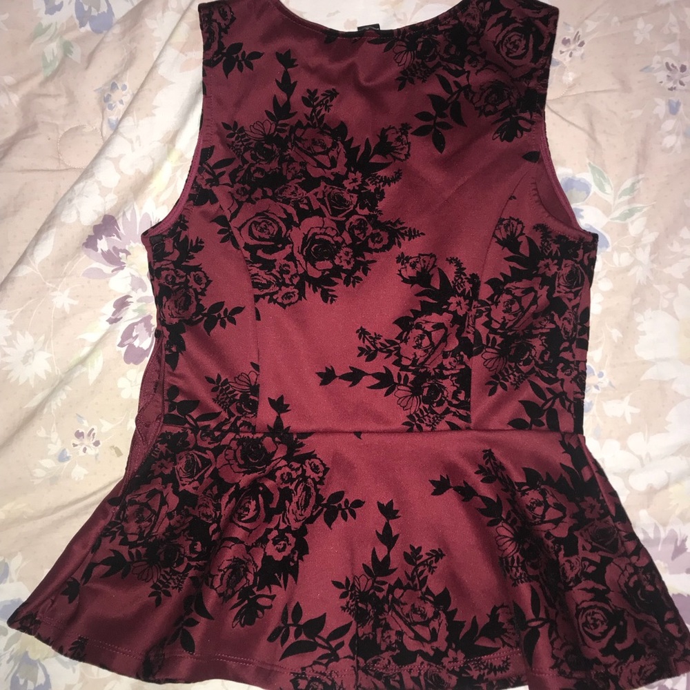 A Forever 21 Maroon no sleeves shirt